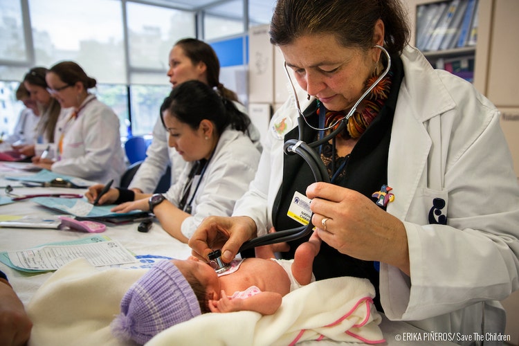 Dr. Nathalie Charpak, Director of the Kangaroo Foundation checks a premature baby for vital signs during a control. “The Kangaroo method humanises the care of newborn premature babies. It reduces mortality rates and improves the quality of life of the babies”, says the doctor, who has worked with the program for over 20 years. Bogota - Colombia. Nov. 06, 2013. ©Erika Pineros